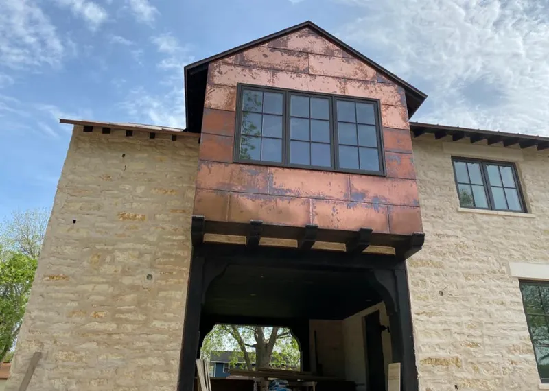Copper metal panel facade on a stone building for Metal Roof Coating in Minnetonka