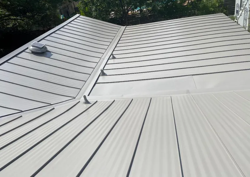 Solar attic fan installed on a metal roof for Roof Ventilation in Minnetonka